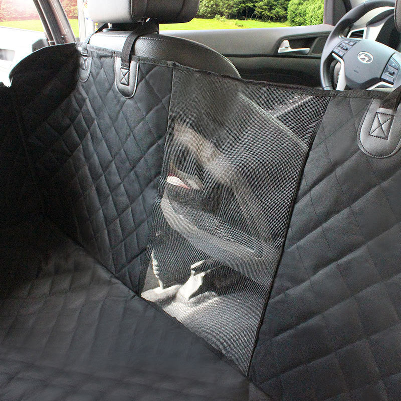 Waterproof pet car seat cover installed in a car with mesh window