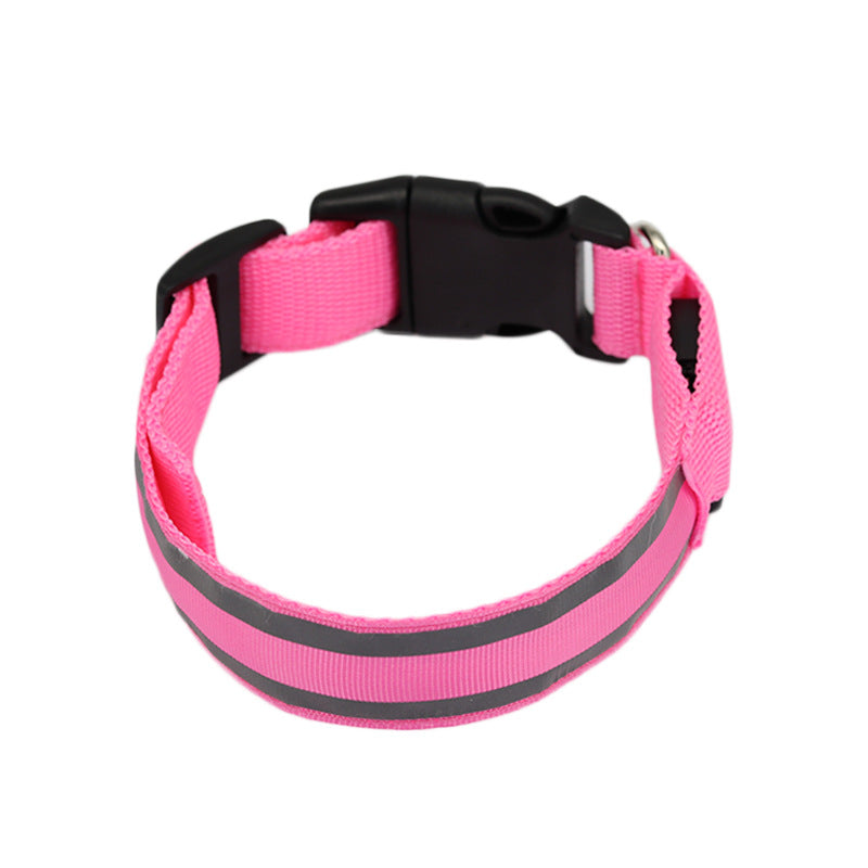 Pink LED dog collar, unlit, on a white background