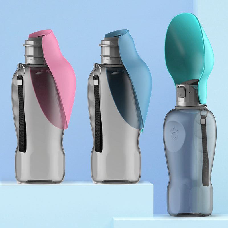 Three portable dog water bottles in pink, blue, and teal on a light blue background