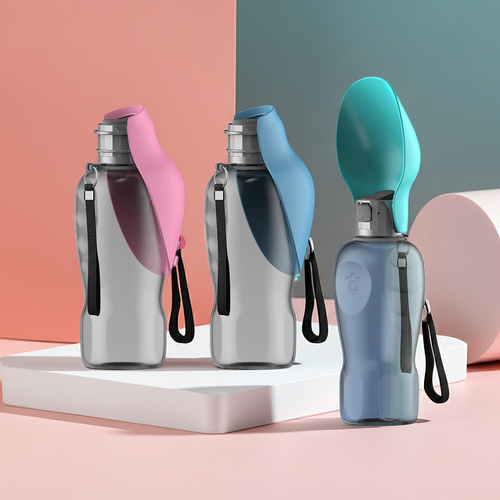 Three portable dog water bottles in pink, blue, and teal on a studio background